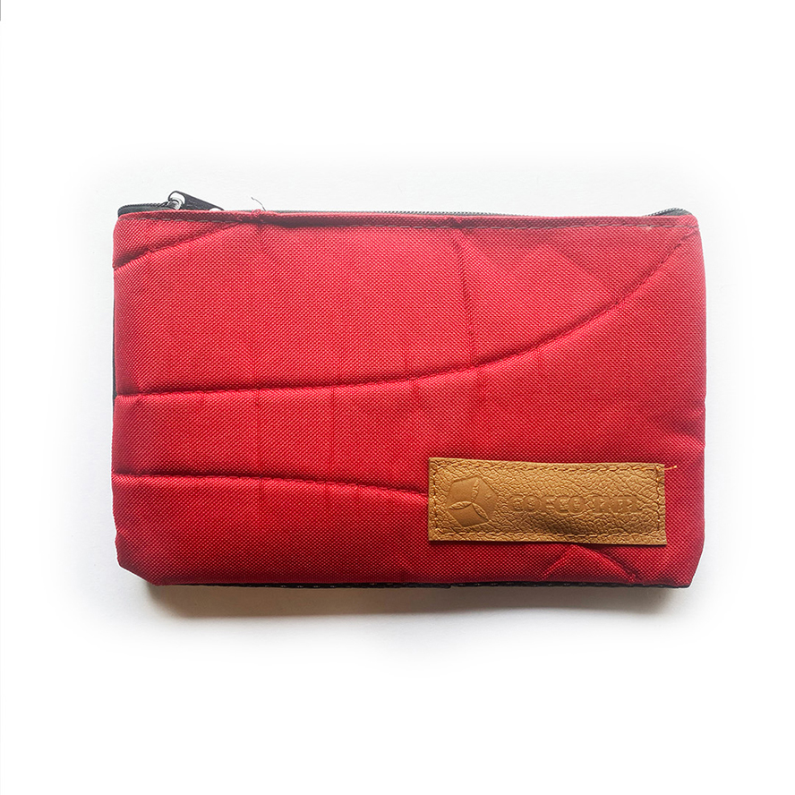 Finished red pouch from upcycled backpacks — COFCO International